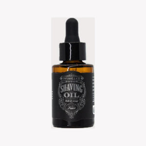 Tonsor & Cie Shaving Oil Ice, Vorderansicht einer bernsteinfarbenen Tropfflasche mit schwarzem Etikett